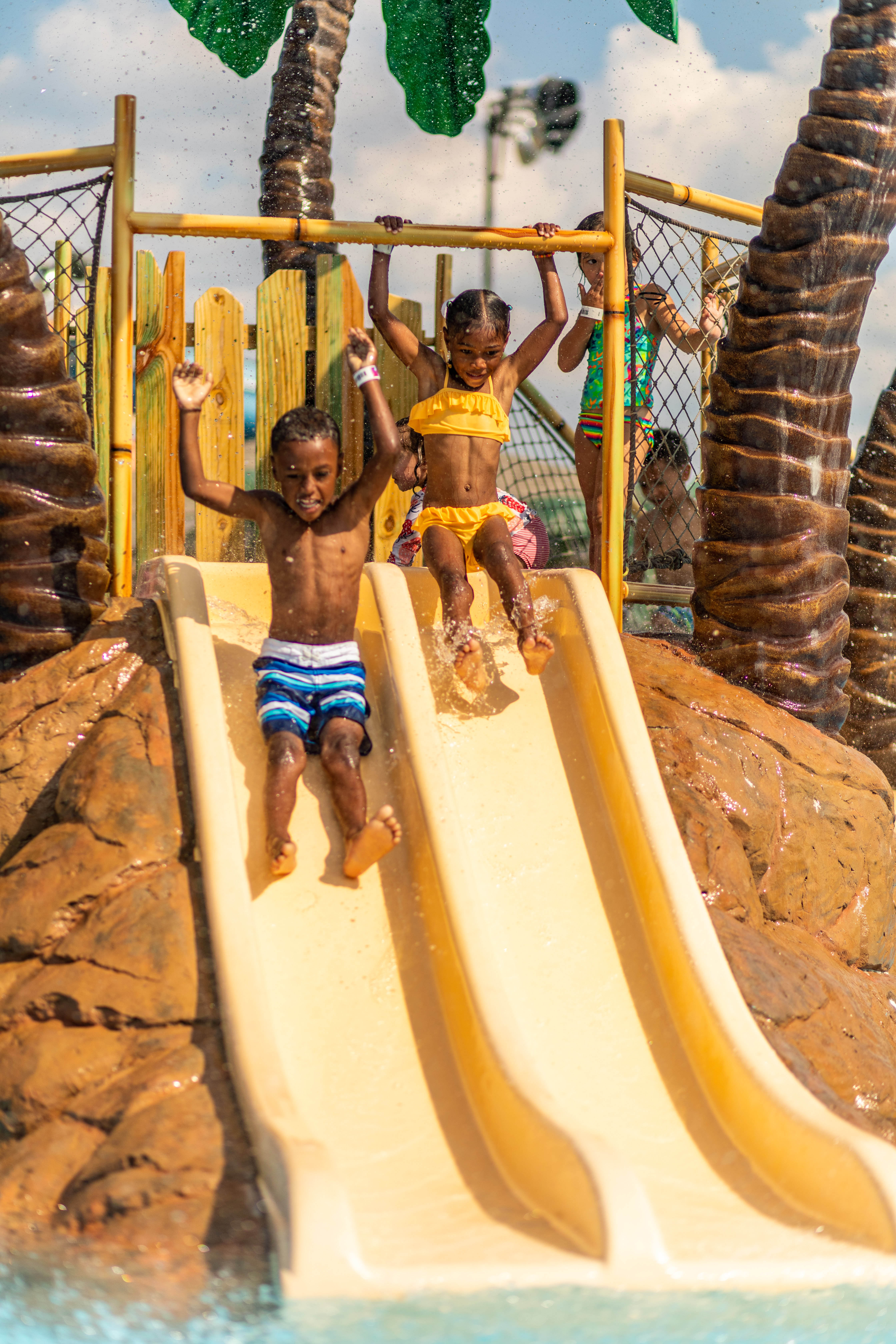 little kids on tiny tot slide